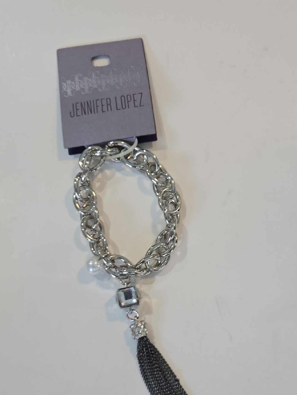 Jennifer Lopez Silver-Tone Chain Bracelet with Black Tassel Charm